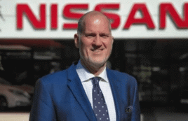 Andrew Humberstone in front of a Nissan sign