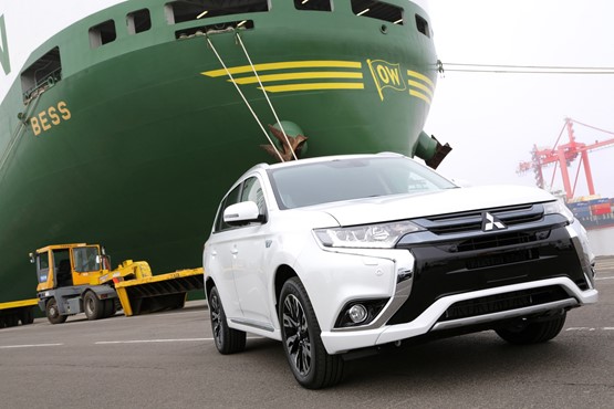 Mitsubishi Outlander PHEV at Bristol docks in the shadow of a container ship