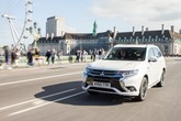 Mitsubishi Outlander PHEV crosses the Thames in front of the London Eye