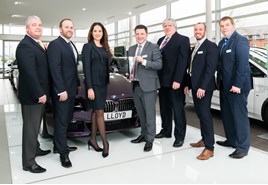 Mark Powell, head of business at Lloyd BMW Blackpool, pictured with the BMW Retailer of the Year award, alongside staff