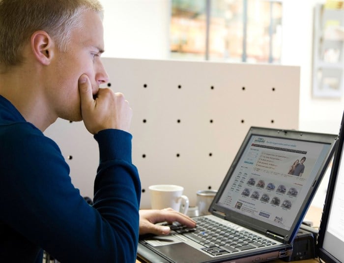 Man assessing insurance costs