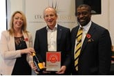 Clive Brook, managing director, Clive Brook Volvo, centre, accepts the AM Best UK  Dealerships to Work For award from LTK Consultants’ managing director, Andrew  Landell, and operations director Vanessa Kendrick