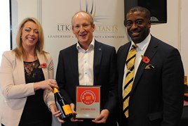 Clive Brook, managing director, Clive Brook Volvo, centre, accepts the AM Best UK  Dealerships to Work For award from LTK Consultants’ managing director, Andrew  Landell, and operations director Vanessa Kendrick