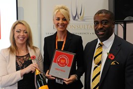 Stacey Turner, HR and legal director, Chorley Nissan, centre, accepts the AM Best UK  Dealerships to Work For award from LTK Consultants’ managing director,  Andrew Landell, and operations director Vanessa Kendrick