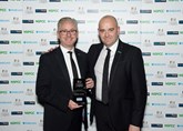 John Tordoff (left), chief executive of JCT600, receiving the award from the main sponsors of the evening Barclays Partner Finance