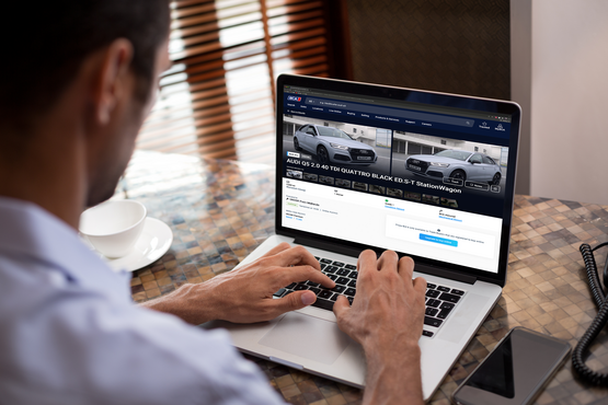 Car buyer browsing used vehicles on BCA's website