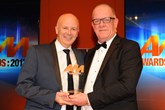 Steve Lane, regional manager, Stoneacre Motor Group, collects his AM Award 2017: Best training and development programme from Mike Macaulay, head of corporate sales,  AutoProtect
