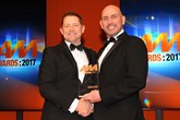 Paul Woodhead, group aftersales director, Swansway Group, collects the AM Award 2017 for excellence in aftersales from  Robert East, head of business development, FUCHS Lubricants