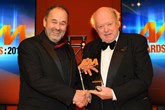 Robin Luscombe, managing director, Luscombe Motors, (left) collects his award from chairman of the judges Christopher Macgowan 
