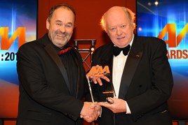 Robin Luscombe, managing director, Luscombe Motors, (left) collects his AM Awards 2017: Best use of video from chairman of the judges Christopher Macgowan 