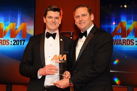 Leo Nelson, marketing & IT  director, CarShop, left, collects  the award from Diego Sanson,  vice-president international  business, CarGurus