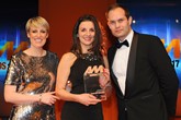 Lee Ann Edison, head of communications, Arnold Clark Automobiles, collects the AM Award 2017 for best retail group (more than 10 sites) from James Hill, sales director, Dealerweb