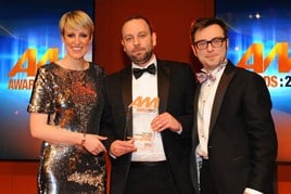 Nick Beevis, general manager,  Perrys Motor Sales Aylesbury, centre,   collects his award from Phill Jones, managing director,  Motors.co.uk