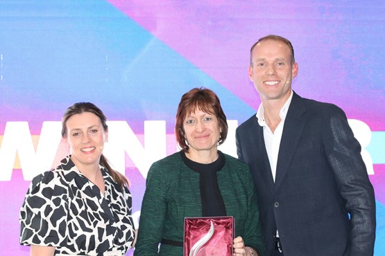 Alison Jones (centre), receives the Barbara Cox Woman of the Year Award from Alison Fisher and Martin Forbes