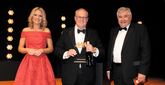 NFDA chairman David Newman (centre) collects the award on behalf of Arnold Clark Automobiles from awards judge, Professor Jim Saker of Loughborough University