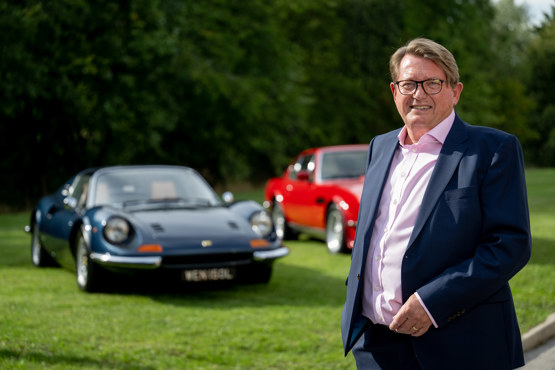 Auto100 managing director Christopher Smith with two of the retailer's classic cars