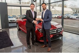 Class: Mercedes-Benz's Krishan Bodhani receives the E-Class' Car of the Year accolade from John Challen
