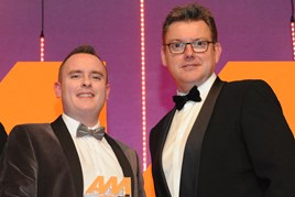 Ben Scholes, communications and content manager, CarShop, collects the award from Jeremy Evans, managing director, Marketing Delivery, right