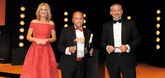 Marshall Motor Group chief  executive Daksh Gupta (centre) collected the award from Tim Pearcey, sales director of Keyloop