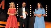 Ish Hussain, general manager, Steven Eagell Toyota Milton Keynes, collects the award from Auto Trader sales director Rebecca Clark (right)