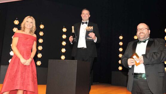 GForces sales director Paul Hilton (centre) picked up the award from AM editor Tim Rose