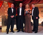 Cox Motor Group's Helen Hayton receives the Dealer of the Year award from Phil Crossman (left), David Hodgetts (centre) and Phil Webb
