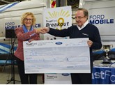 Breakout for Ben: Ben chief executive, Zara Ross, accepts the cheque from TrustFord chairman and chief executive, Stuart Foulds