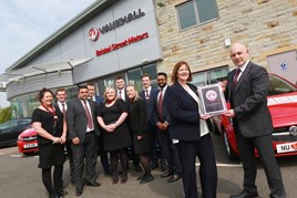 Susan Hughes (second right), Vauxhall’s network development manager, presents Chris Catterall (far right) and the Bristol Street Motors Keighley team with the Vauxhall Customer Excellence Award.