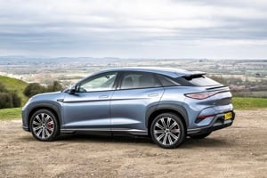 A picture of a silvery grey BYD Sealion 7 electric car in the countryside
