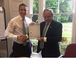 TrustFord’s chairman and chief executive Stuart Foulds presents finance director Stuart Mustoe with his 20 years’ service certificate.