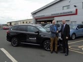 Colin Dyer, chief executive of WellChild (left), with Bruce Simpson, group operations manager of CCR Mitsubishi