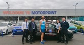 ​Motorpoint Peterborough employee Chris Northern (centre) with his supportive work colleagues