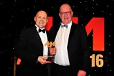 Colin McAllister, group training and development manager, John Clark Motor Group (left), collects his award from Mike Macaulay, head of corporate sales, AutoProtect