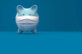  Piggy Bank Wearing A Surgical Mask over blue background. covid-19