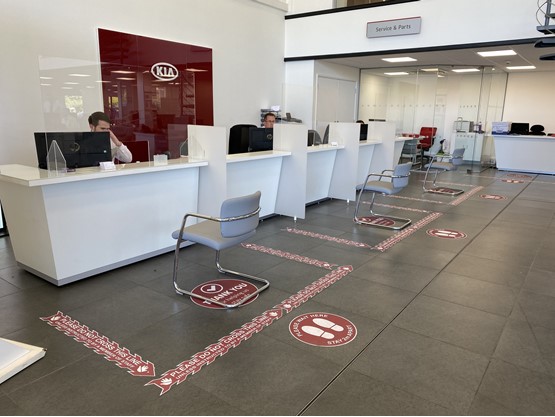 Socially distanced service reception at a Kia dealership under COVID-19 coronavirus experience