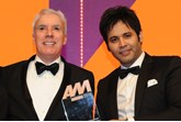 Dale Wyatt, director automobile,  Suzuki GB, collects the award from Khusro Kamal, chief executive, Car Finance Giant, right