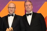Darren Edwards, chief executive, Sytner,  collects the award from Dave Woodman, UK and Ireland business development manager, MOTUL, right