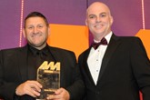 Dave Wright, corporate quality manager, Norton Way Motors, collects the award from Stewart Grant, commercial director, Santander Consumer Finance, right 