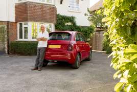 David Franklin and his new red Fiat 500 Electric.