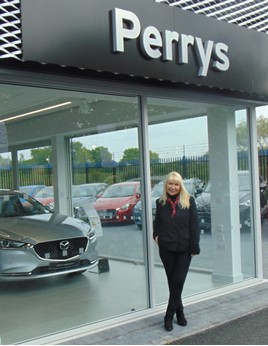 Perrys director Denise Millard outside Perrys Mazda Canterbury
