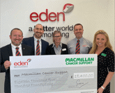 Eden Motor Group team presenting cheque to Macmillan Cancer Support
