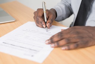 A car finance agreement being signed