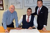 New signing (from left): Chorley Group chairman Andy Turner welcomes Phil Lambert alongside sales director Adam Turner
