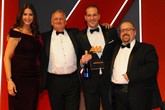 Gerry Kouris, head of marketing,  Alphera Financial Services, (second from right)  accepts the award from AM   editor Tim Rose, right and host Lisa Snowdon, left