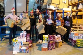 Swansway Group employees pack gifts for less fortunate children.