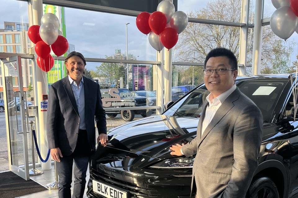 Bono Ge, UK BYD country manager shakes hands with Paul Tanner, CEO of Alan Day Motor Group
