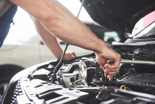 mechanic repairing car