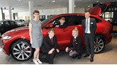 Farnell Jaguar Bolton general manager James Boyd and visitors from Harper Green School
