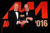 John Oakley, aftersales manager, Crewe Audi (left), collects the award for Best Service Reception Team from Christopher Macgowan, chairman of the judges