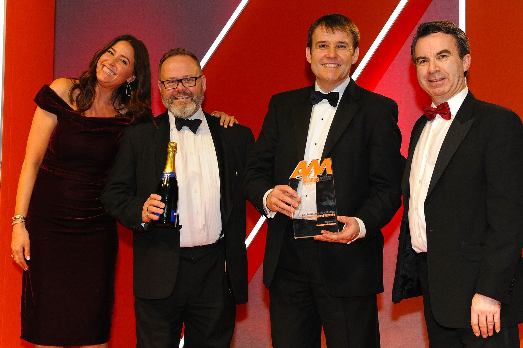 Jonathan Gravell, managing director, Gravells of Kidwelly, second from right, and Ian Gravell, general manager, second from left, accept the award from Lance Boseley, marketing director,  Jewelultra (manufacturers of Diamondbrite), right, and host Lisa Snowdon, left